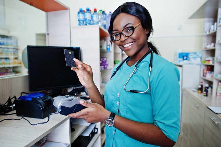 African american pharmacist working in drugstore