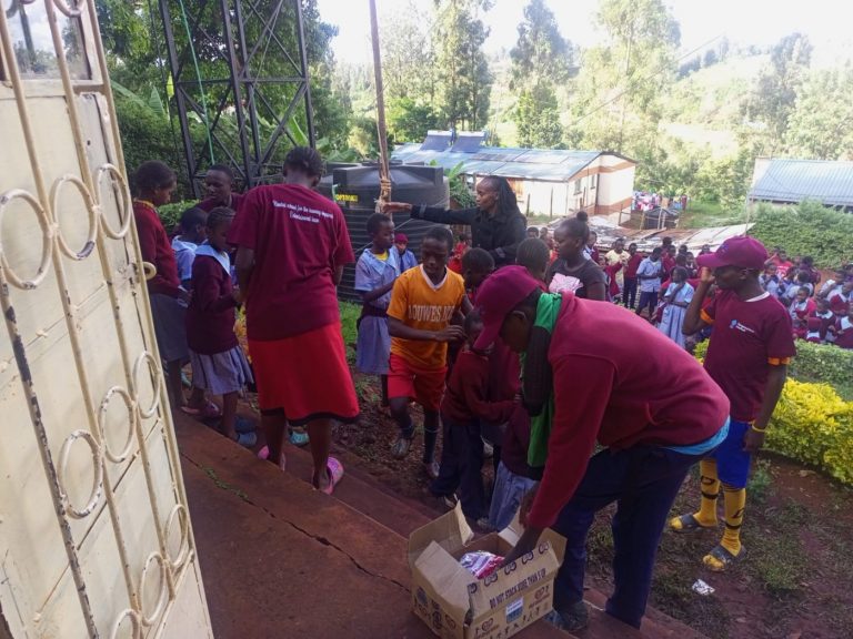 Handing out supplies at Kambui School for the Hearing Impaired